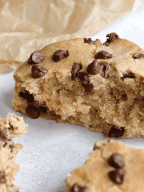 Homemade copycat Hardee’s chocolate chip cookies with golden edges and melted chocolate chips on parchment paper