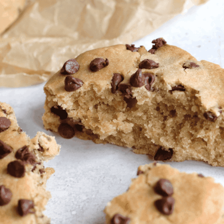 Homemade copycat Hardee’s chocolate chip cookies with golden edges and melted chocolate chips on parchment paper