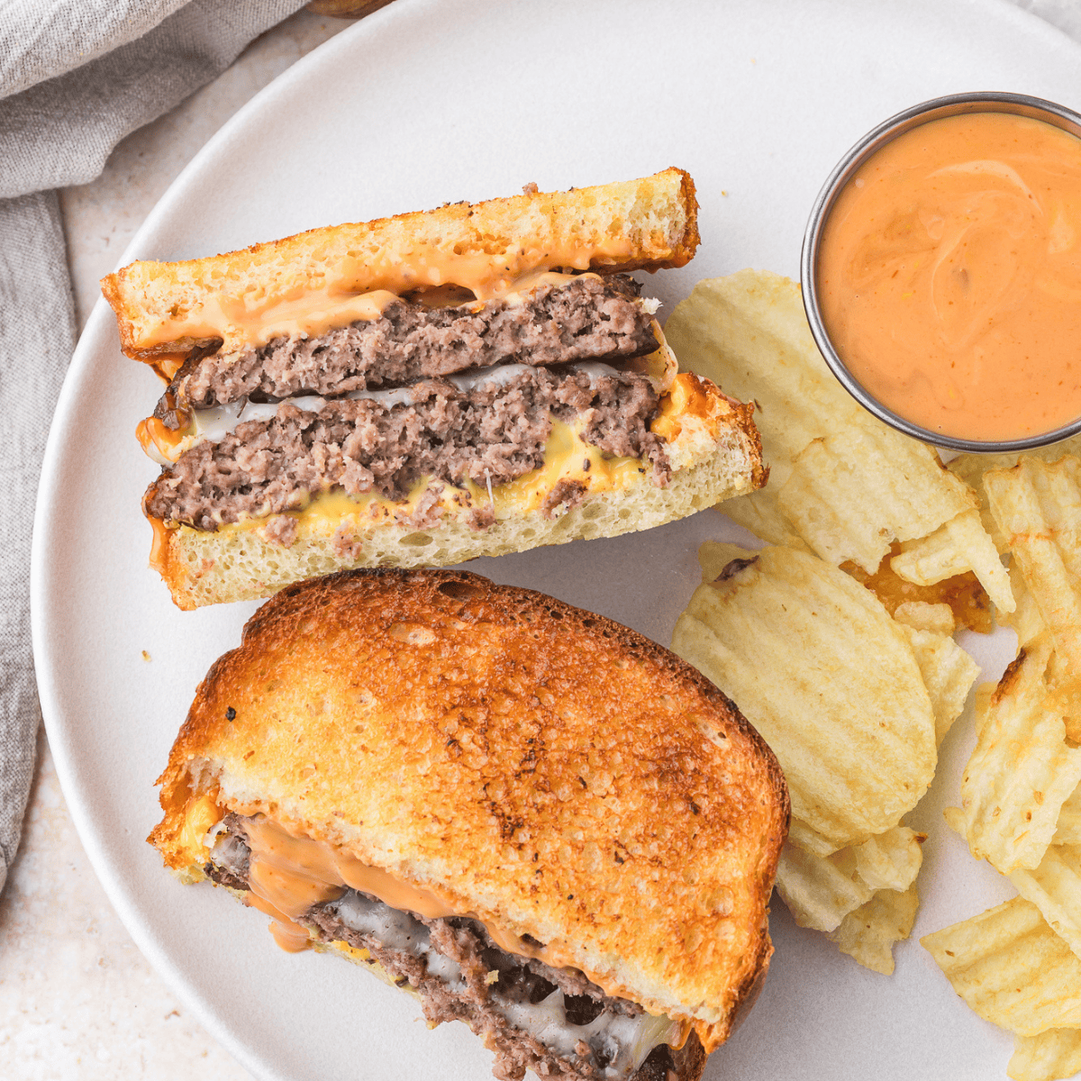 Make the iconic Hardee’s Frisco Burger at home with this easy copycat recipe—featuring crispy sourdough bread, melty Swiss and American cheese, and a perfectly grilled beef patty.