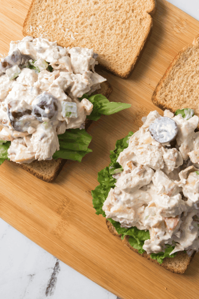 Creamy homemade Arby’s chicken and pecan salad served in a white bowl with diced apples and pecans