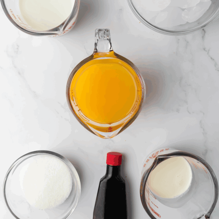 Ingredients needed for Ninja Creami Arbys Orange Creamsicle Shake Recipe on kitchen table.