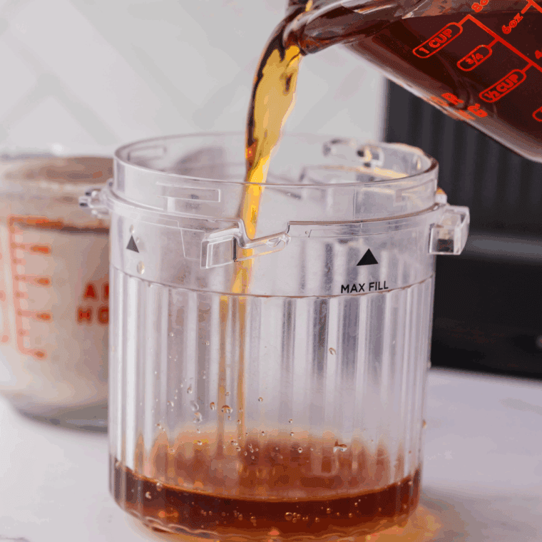 Add cold coffee into the Ninja Creami Pint Container.