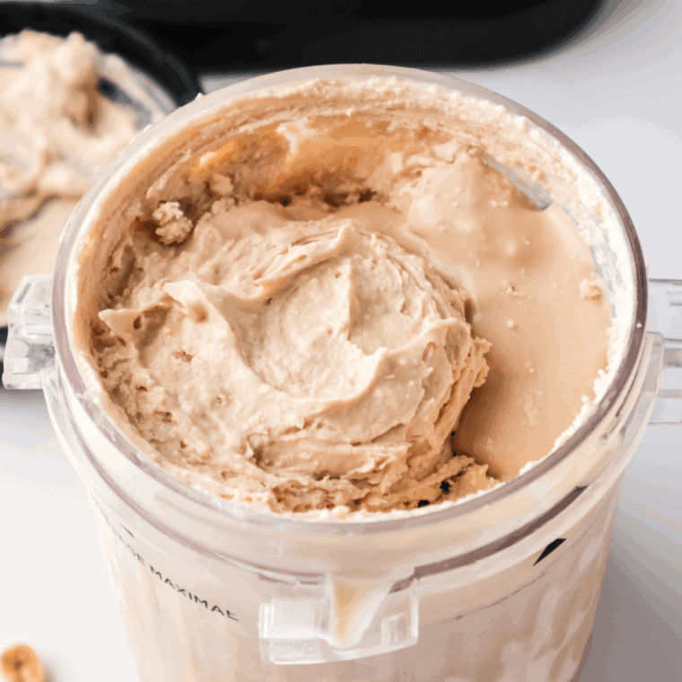 Chopped Snickers and peanuts added to center well of processed ice cream