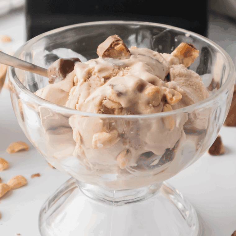 Homemade Snickers Blizzard made in the Ninja Creami with chopped Snickers and vanilla ice cream.