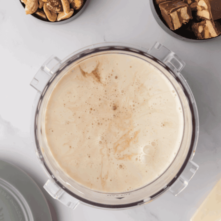 Ice cream base mixture being poured into a Ninja CREAMi pint container