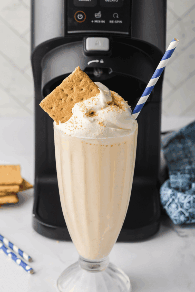 Ninja Creami McDonald’s Vanilla Milkshake served in a tall glass with whipped cream and a cherry on top.