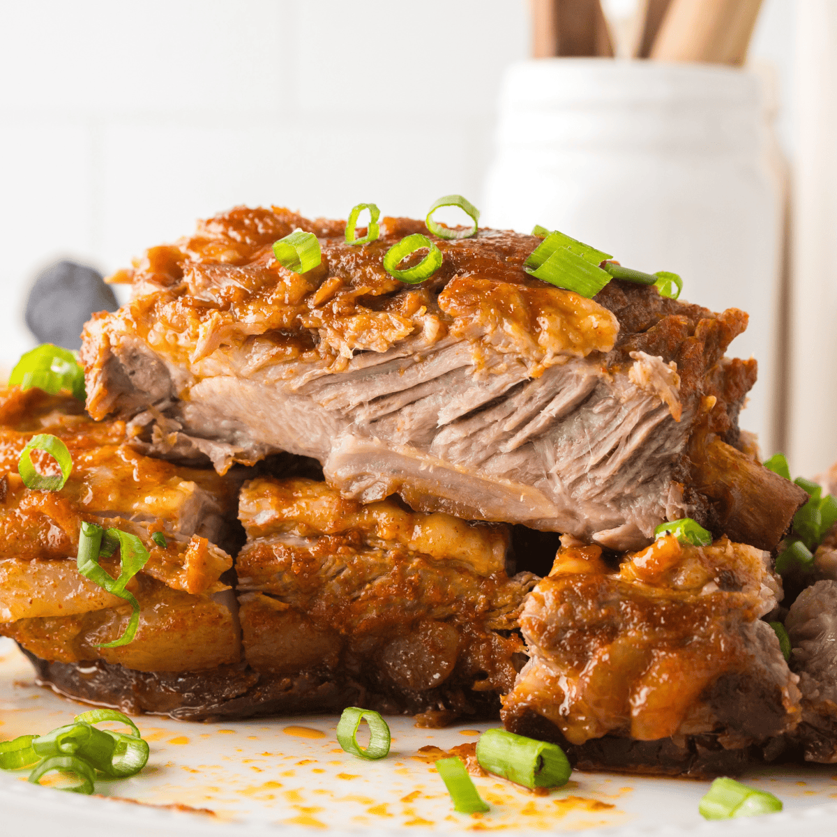 A homemade sauce full of traditional ingredients such as mirin, gochujang sauce, and minced ginger among others, is poured over pork ribs to create these bright, bold Korean BBQ ribs.