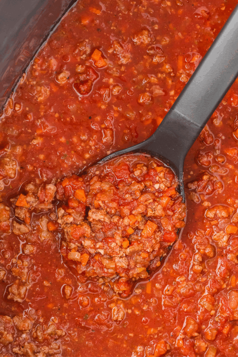 Ninja Foodi Possible Cookware Pro Cooking a thick savory meat sauce that is ready to be eaten on pasta.