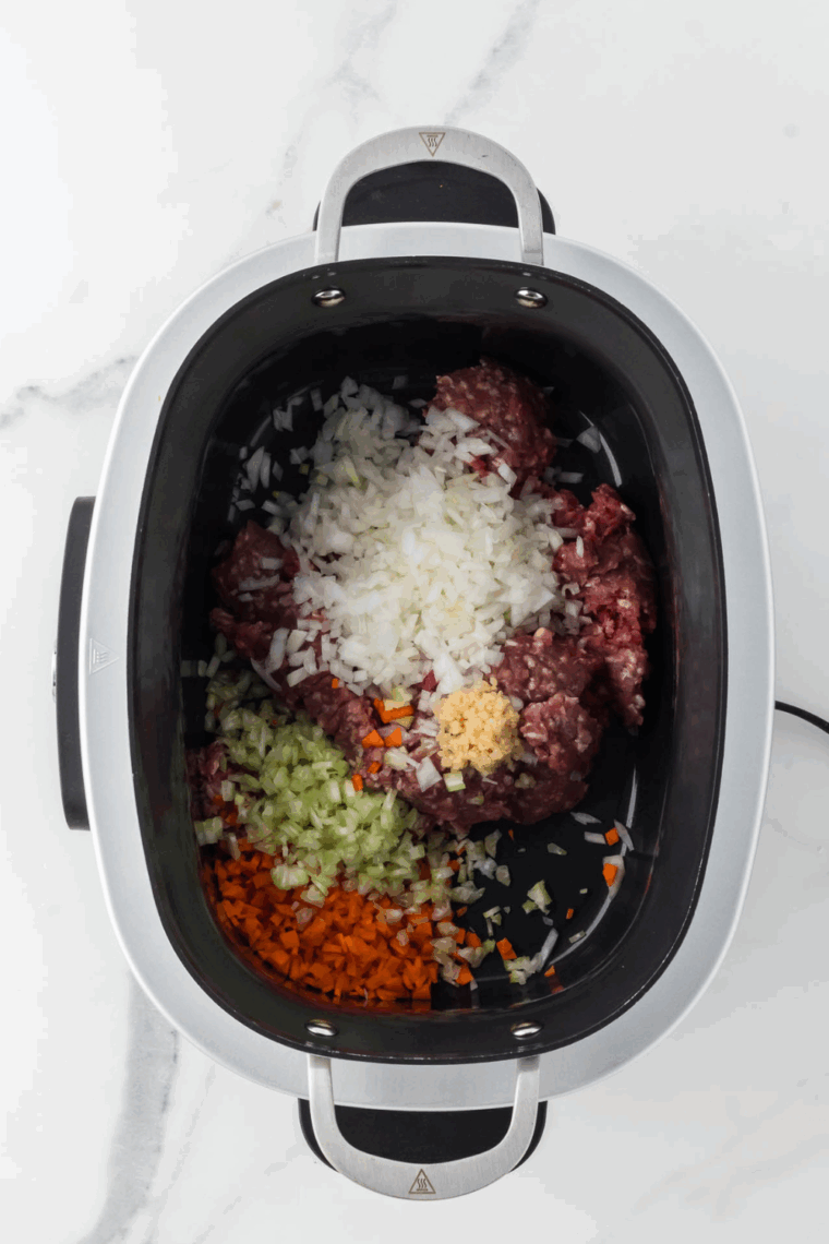 Sauté diced onion, carrots and celery in Ninja Foodi Possible Cooker Pro.