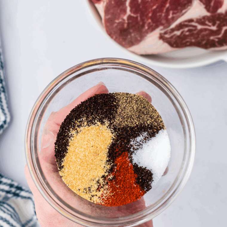 Mixing the spice in a large mixing bowl or mason jar.