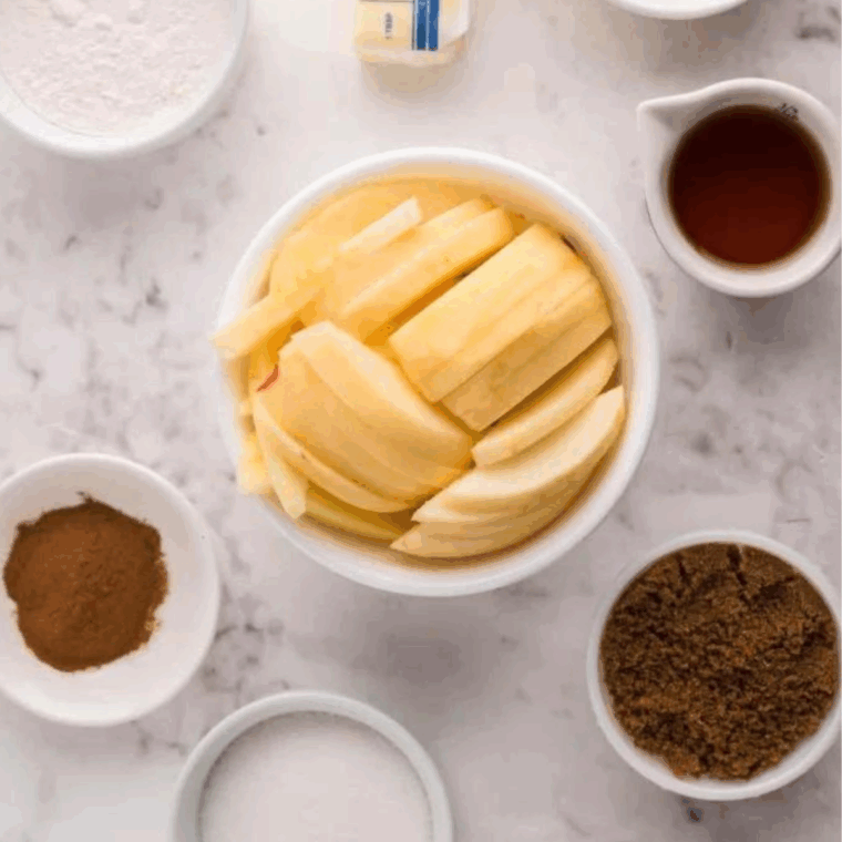 Ingredients needed for Outback Steakhouse Cinnamon Apple Oblivion on kitchen table.