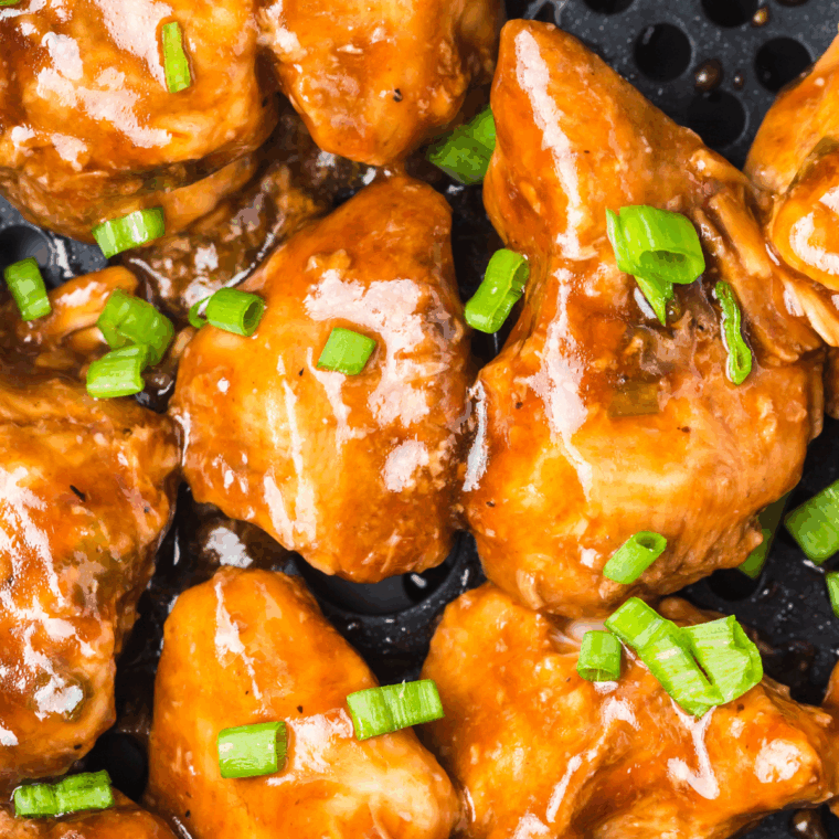 Juicy grilled teriyaki chicken served with rice and sauce.