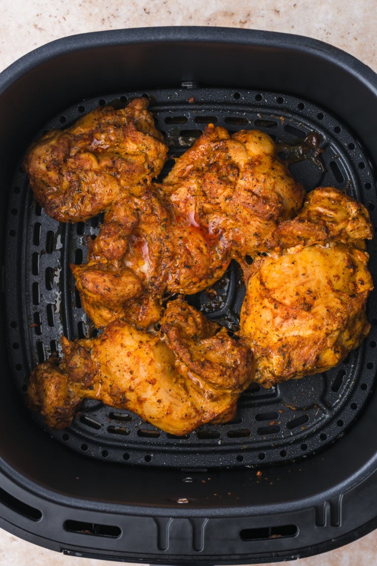 Cooked Trader Joe’s Shawarma Chicken Bowls in the air fryer basket.