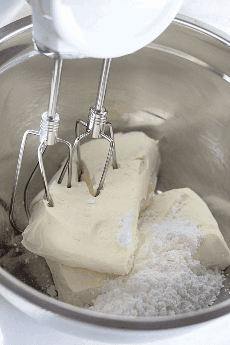 Whisk cream cheese and powdered sugar until smooth in a mixing bowl.