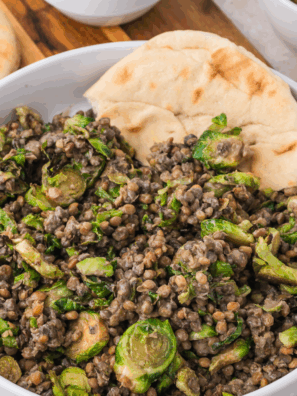 Transfer the Brussels sprouts to a large bowl and mix in the steamed lentils. Pour in the Trader Joe’s Organic Toasted Sesame Dressing and give it all a good toss to coat. Serve warm for a delicious and nutritious salad that’s ready in minutes!