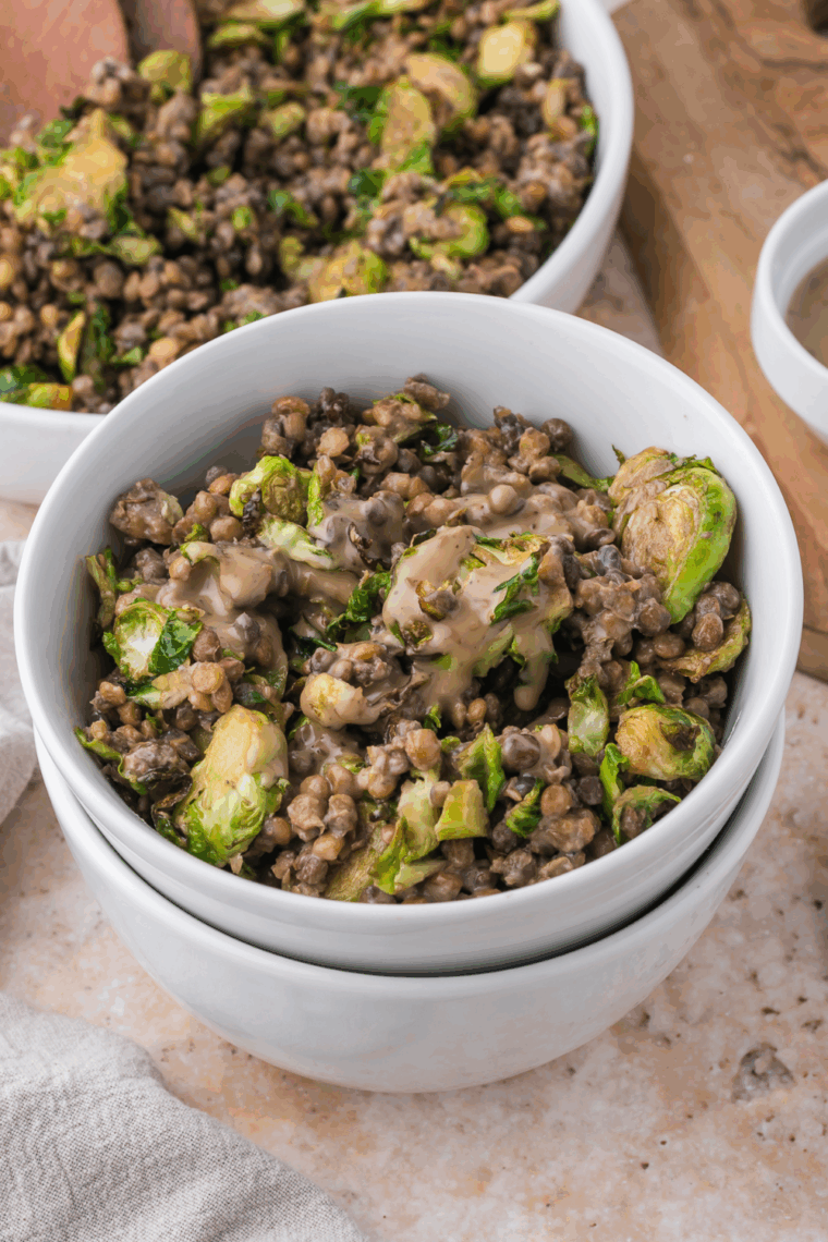 Close-up of Trader Joe’s Easy Sesame Brussels Sprouts and Lentil Salad with crispy Brussels sprouts, lentils, and sesame dressing in a bowl.