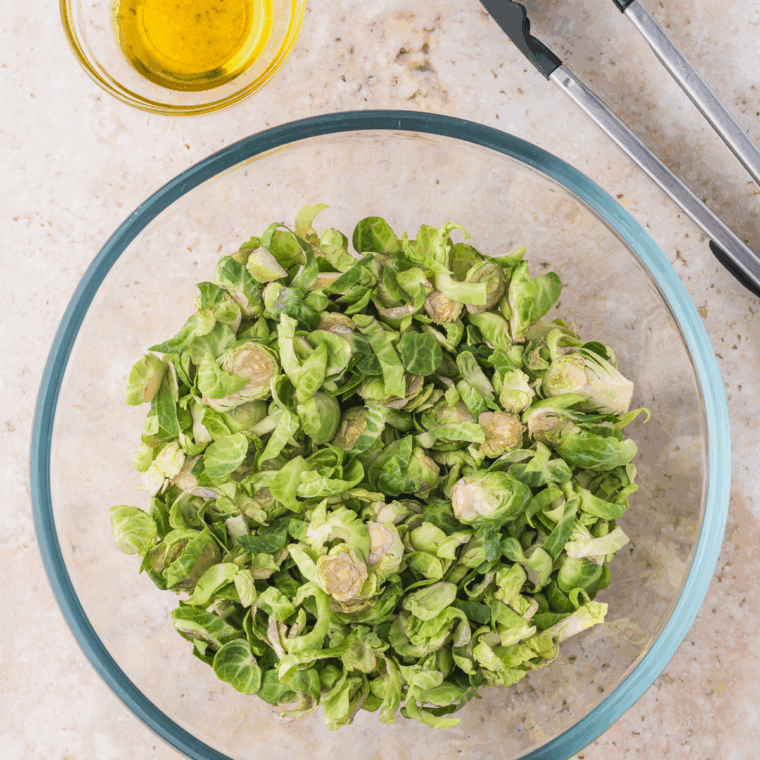 Preheating air fryer to 375°F to ensure crispy, evenly cooked Brussels sprouts.