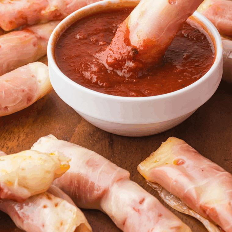 Bowl of homemade Arby’s-style marinara sauce served with mozzarella sticks.