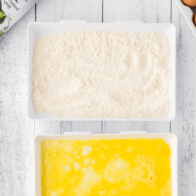 Mixing flour, cornstarch, salt, pepper, garlic powder, paprika, and onion powder in a bowl.