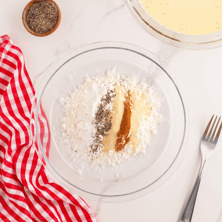 Prepare the seasoned flour in a large mixing bowl.