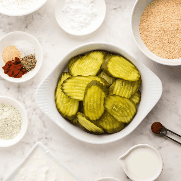 Ingredients needed for Arthur Treacher’s Fried Pickles Copycat Recipe on kitchen table.