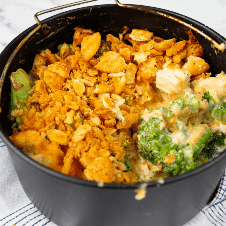 Mixing panko breadcrumbs with melted butter; sprinkling buttery crumbs over the casserole; baking until golden and bubbly; cooling slightly before serving.