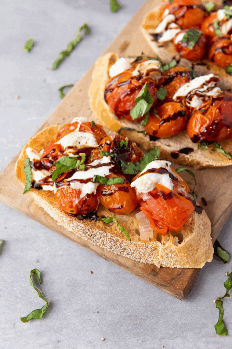 Carrabba’s Tomato Caprese with fresh burrata, roasted tomatoes, basil, and balsamic drizzle.