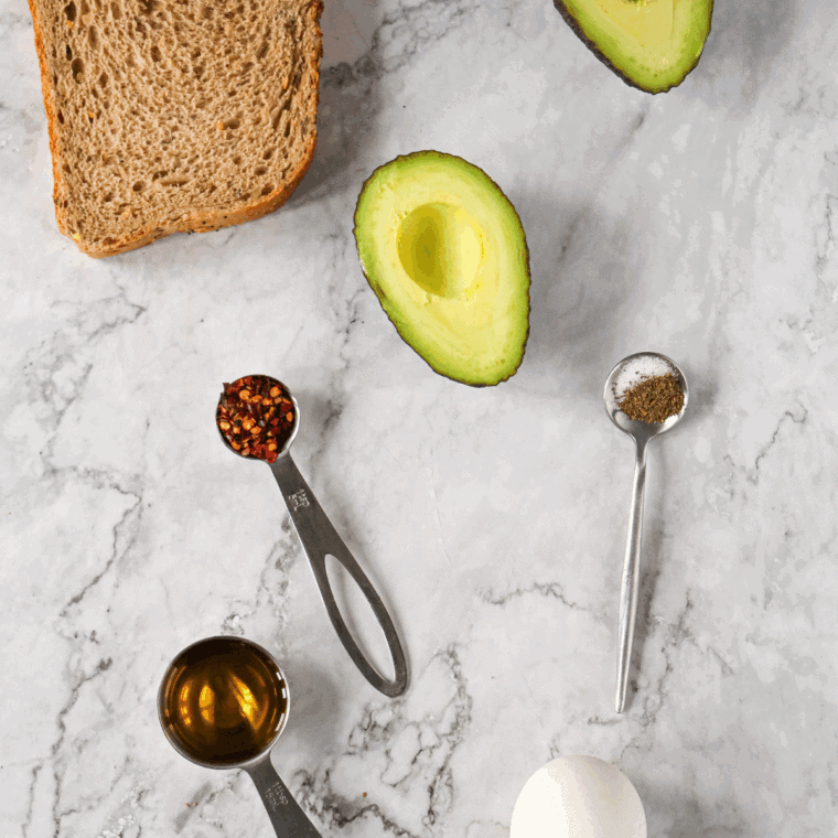 Ingredients needed for Cheesecake Factory Avocado Toast Recipe on kitchen table.