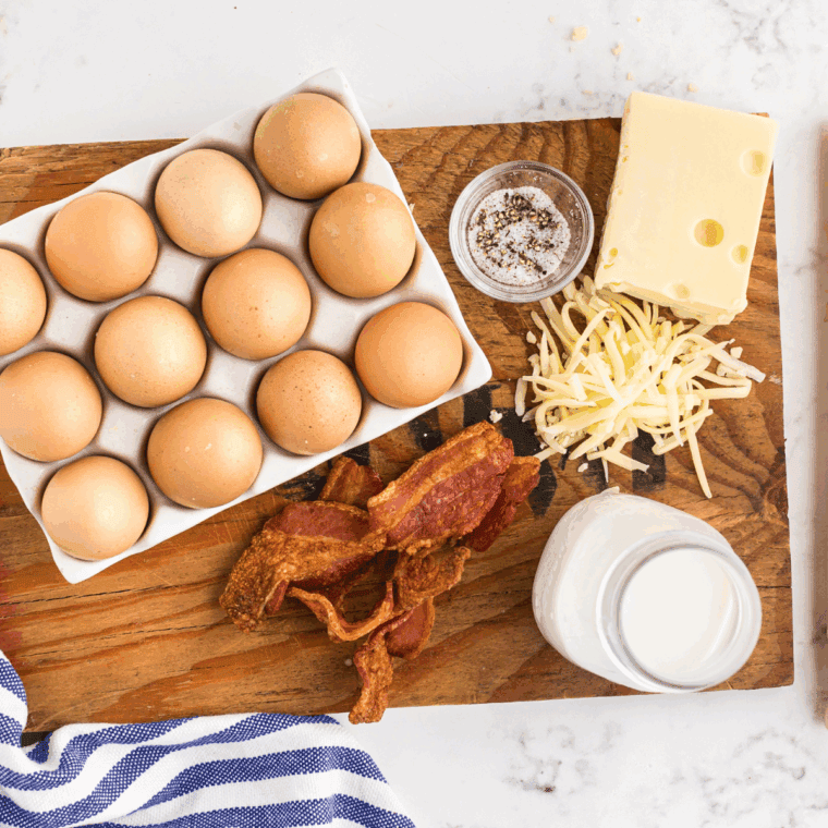 Ingredients needed for Copycat Cracker Barrel Bacon & Cheddar Quiche Recipe on kitchen table.