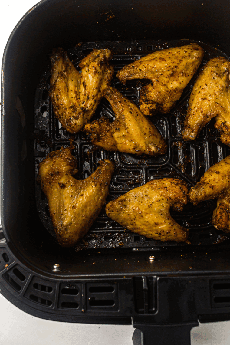 Homemade Copycat LongHorn Steakhouse wings served with dipping sauce on a platter