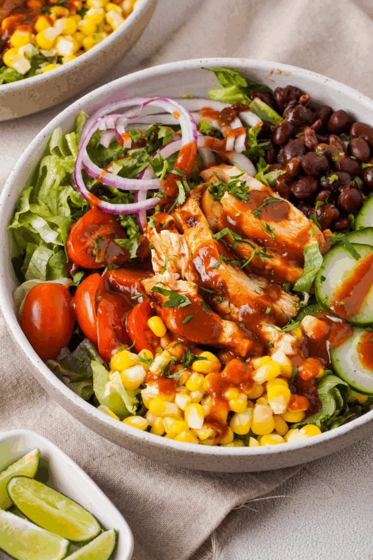 Bowl of Copycat Panera BBQ Chicken Salad with grilled chicken, corn, black beans, tortilla strips, and ranch dressing