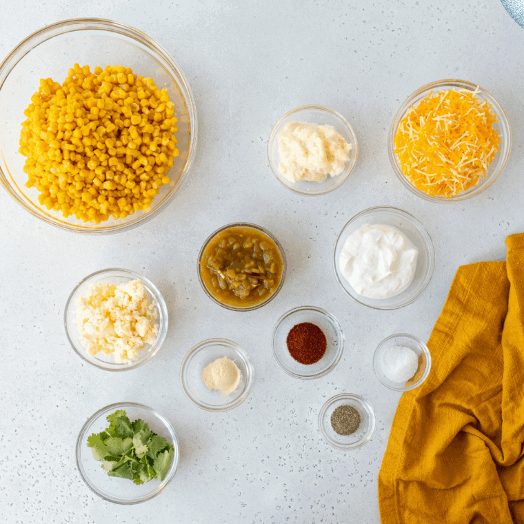 Ingredients needed for Easy Mexican Street Corn Casserole on kitchen table.