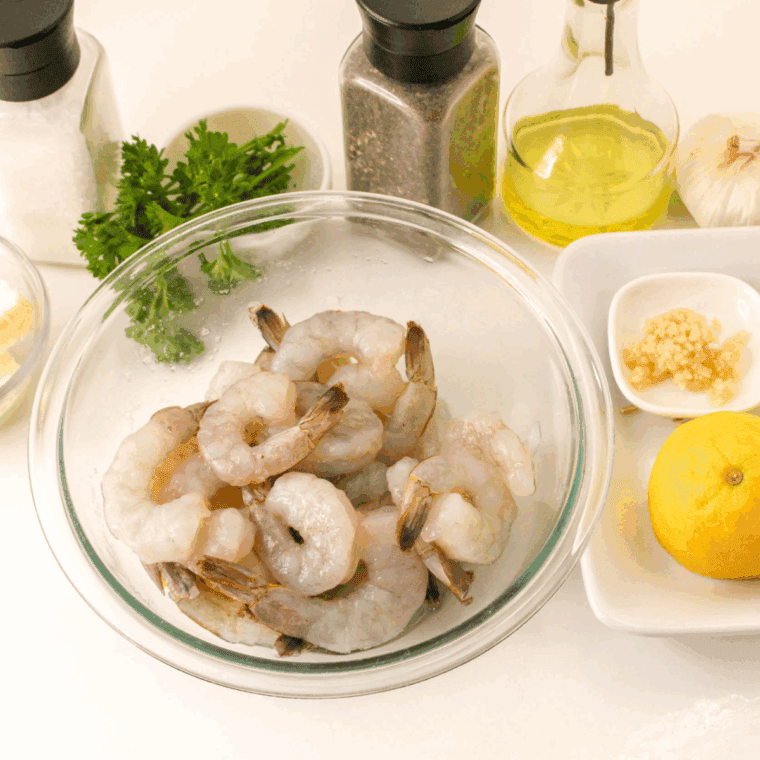Ingredients needed for Easy Shrimp Scampi Recipe (without wine) on kitchen table.