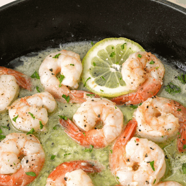 Shrimp scampi cooked in garlic lemon butter sauce served over pasta without wine.