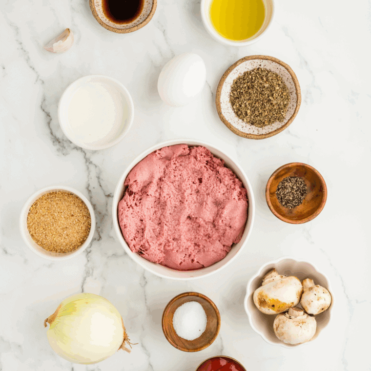 Ingredients needed for Gordon Ramsay's Meatloaf Recipe on kitchen table.