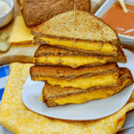 Homemade Disneyland-style grilled cheese sandwich with melted cheese and golden toasted bread.