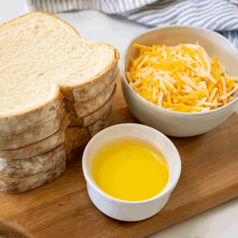 Ingredients needed for Homemade Disneyland Grilled Cheese Sandwich Recipe on kitchen table.