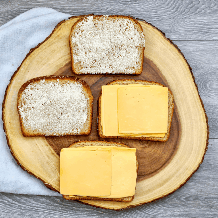 Add the cheese on top of the bread.