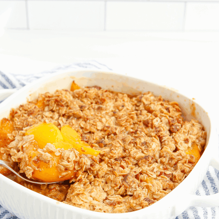 Homemade Honey Bunches of Oats copycat cereal with crunchy oats, honey, and nuts served in a bowl with milk.