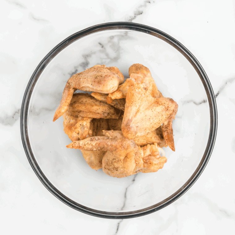 Raw chicken wings patted dry on paper towels