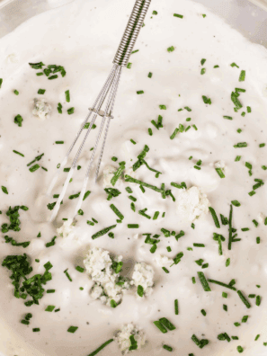 Ina Garten Buttermilk Blue Cheese Dressing served in a bowl with salad on the side.