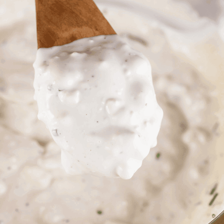 Whisk buttermilk, mayonnaise, sour cream and vinegar in a bowl.
