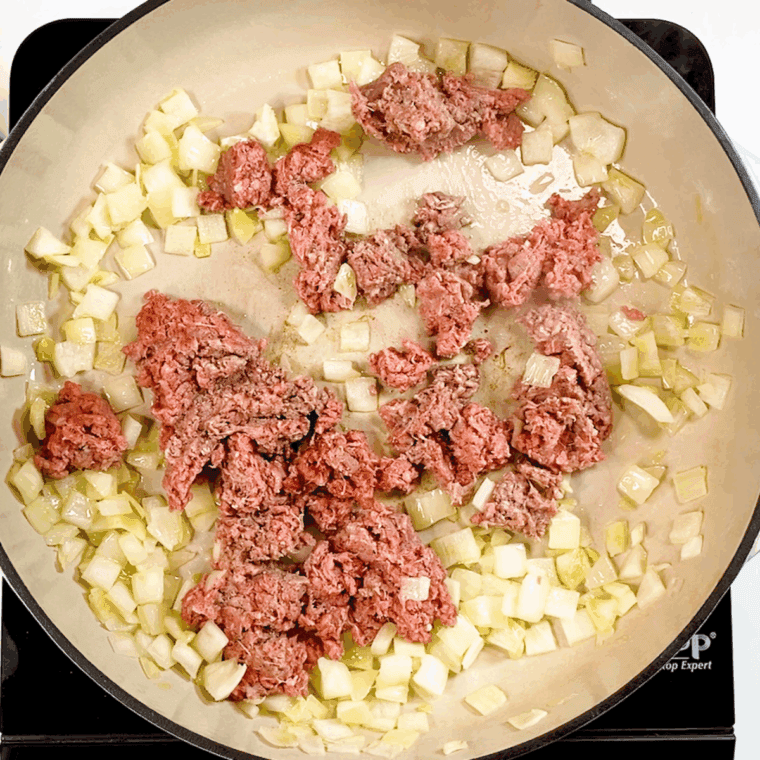 Saute the ground beef and onions in a large saucepan.