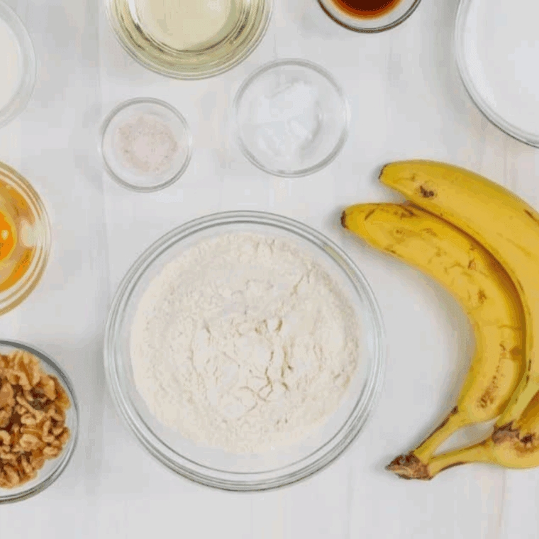 Ingredients needed for Ina Garten's Banana Bread Recipe on kitchen table.