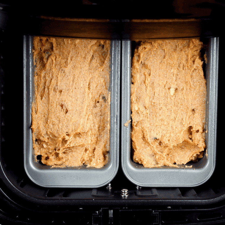Folding wet banana mixture into dry ingredients to make lumpy, moist batter.
