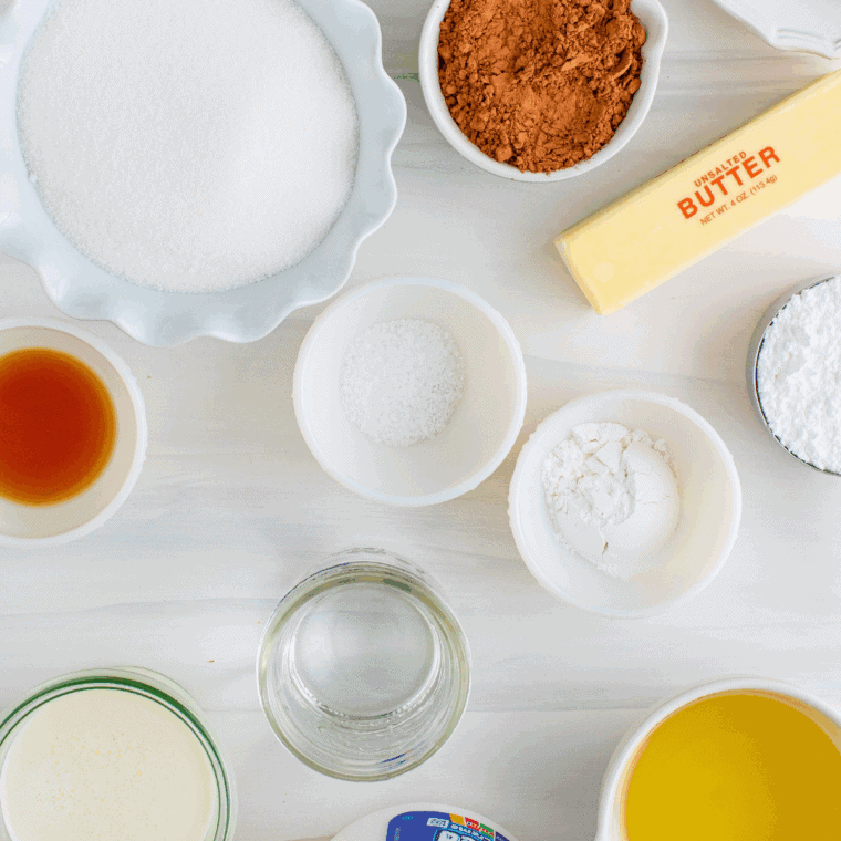 Ingredients needed for From Scratch Lemon Raspberry Cupcakes on kitchen table.