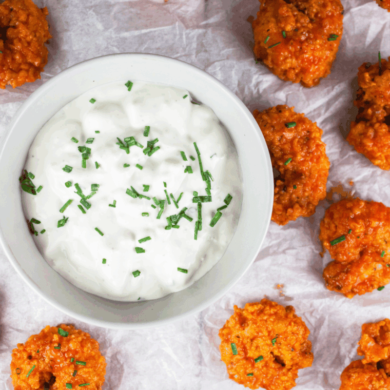 Homemade LongHorn Steakhouse-style blue cheese dressing in a bowl with creamy texture and crumbled blue cheese