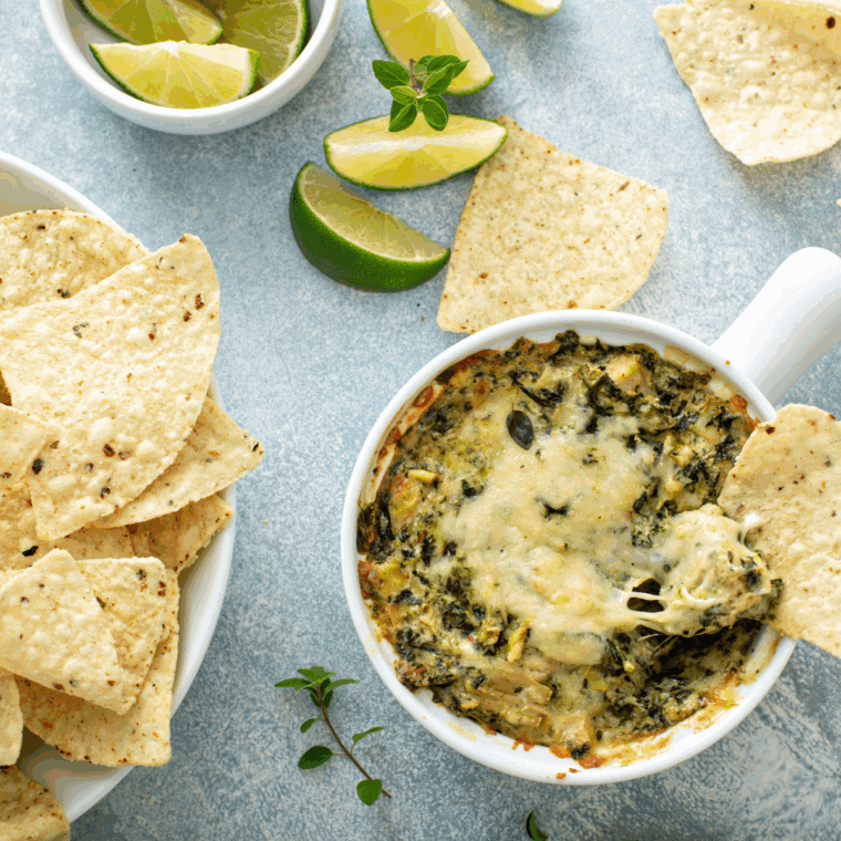 Cheesy Longhorn Steakhouse copycat Parmesan crusted spinach dip baked until golden and served with tortilla chips