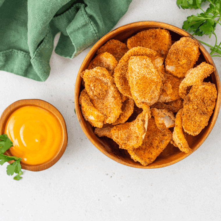 LongHorn Steakhouse style Texas Tonion dipping sauce served in a small bowl with crispy onion petals for dipping