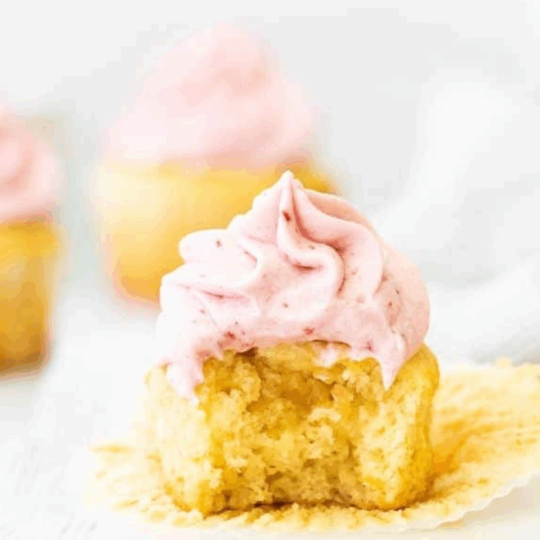 Smooth and creamy raspberry frosting made with fresh raspberries and raspberry jam on a cake.
